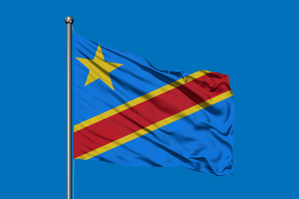 istock Flag of Congo waving in the wind against deep blue sky. Congolese flag. 1077123228