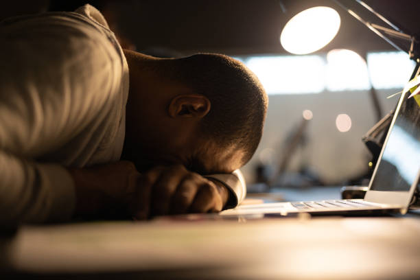 Tired businessman resting at the workplace Workaholic narcolepsy stock pictures, royalty-free photos & images