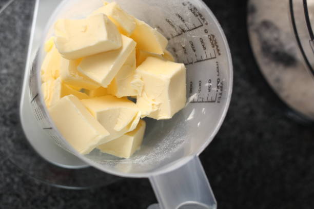 istock Weighing Diced Butter. Making Shoofly Tart Series. 1077123292
