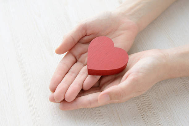 istock Heart object in female hands 1077125168