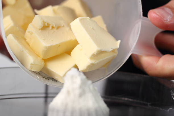 istock Transfer diced butter into food processor. Making Shoofly Tart Series. 1077125362