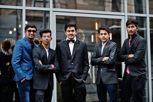 istock Group of 5 indian students in suits posed outdoor. 1077127830