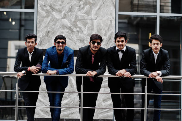istock Group of 5 indian students in suits posed outdoor. 1077127850