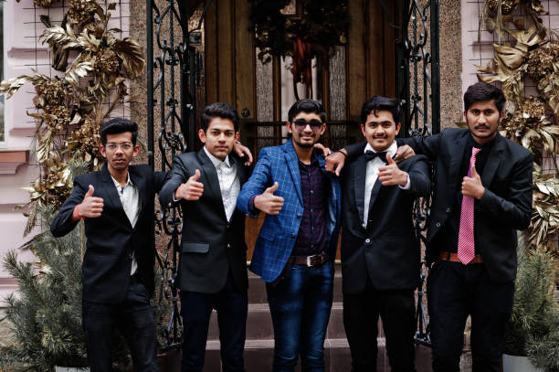 istock Group of 5 indian students in suits posed outdoor. 1077128498