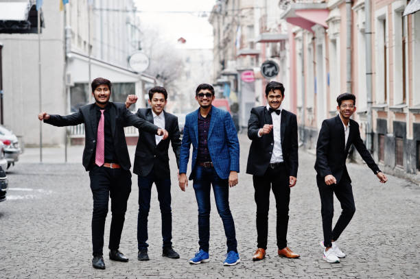 istock Group of 5 indian students in suits posed outdoor. 1077128750