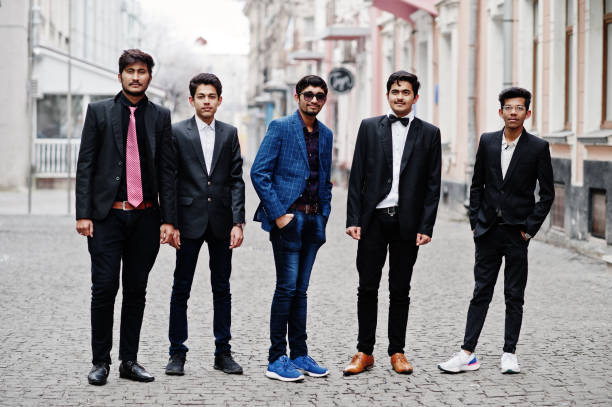 istock Group of 5 indian students in suits posed outdoor. 1077128752