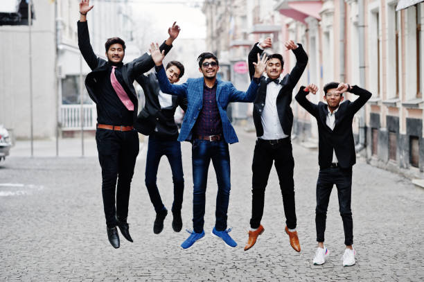 istock Group of 5 indian students in suits posed outdoor. 1077128780