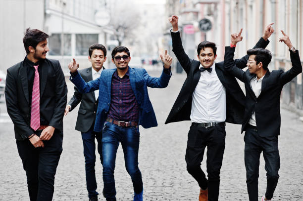 istock Group of 5 indian students in suits posed outdoor. 1077128796