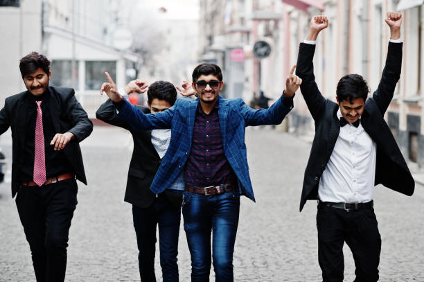 istock Group of 5 indian students in suits posed outdoor. 1077128806