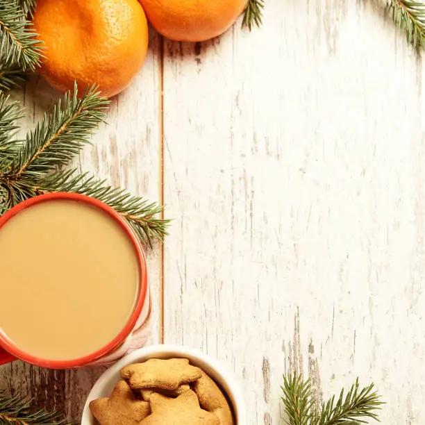 NewYear. Cup of coffee. Delicious tangerines. Spruce branch. Gingerbread Cookie.