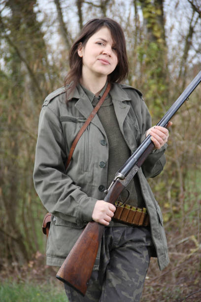 istock woman hunter with shotgun 1077130022