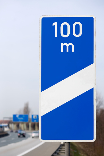 Road sign at the highway - indicates the distance to the next motorway exit: 100m - german road sign