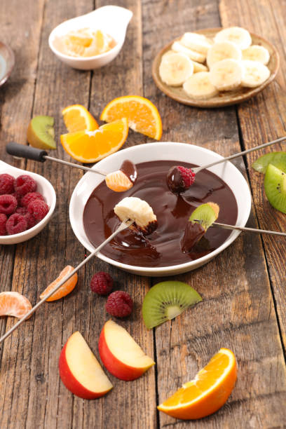 istock chocolate fondue with fruits 1077132268
