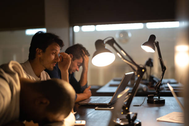 Tired team resting at the workplace Workaholic narcolepsy stock pictures, royalty-free photos & images