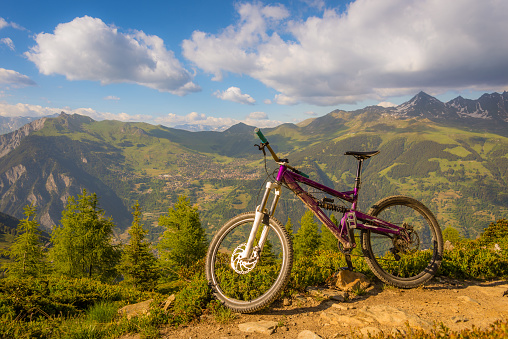 A mountain bike on a trail above the Swiss alps travel destination of Verbier, popular in summer with tourists for mountain biking.