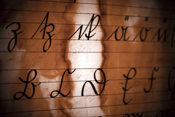 Vintage old Latin Alphabets on Paper Background Photo