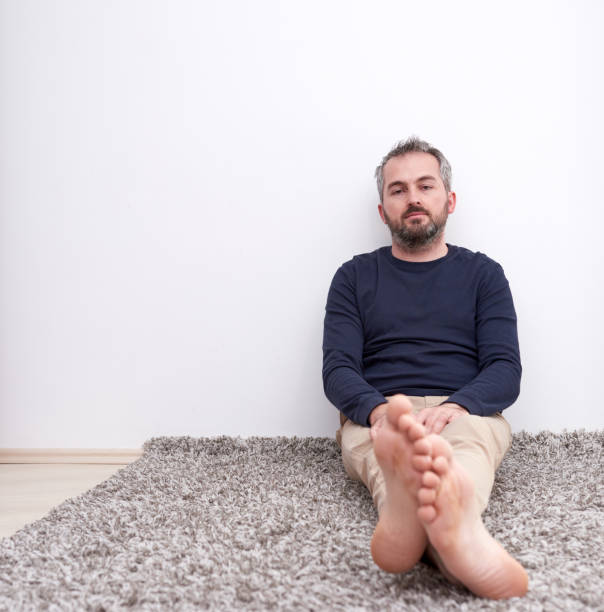 istock pensive adult man 1077139442