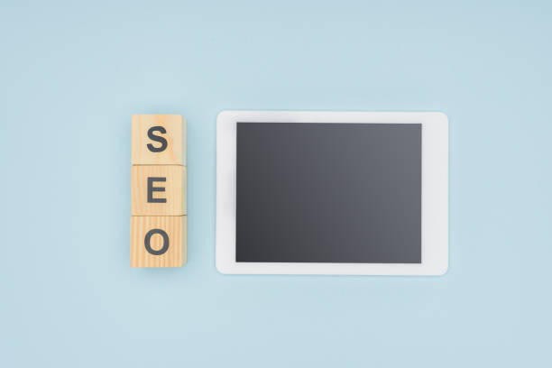 istock Top view of digital tablet with blank screen on light blue background 1077139774