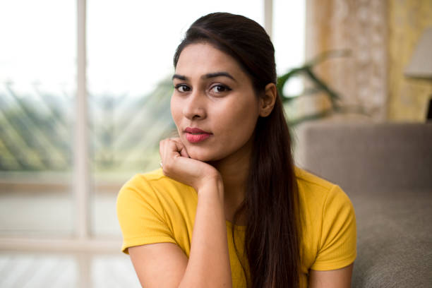 istock Beautiful woman with hand on chin 1077145608