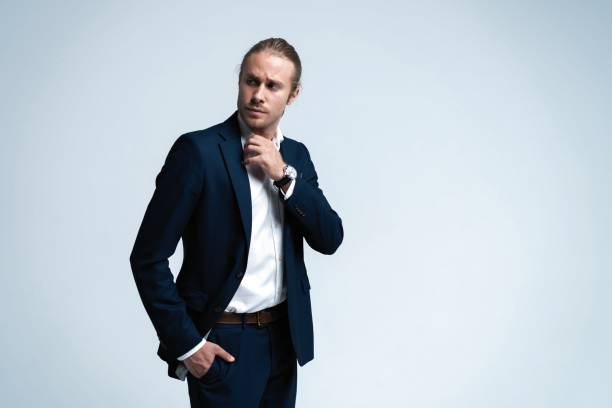 istock Portrait of handsome man in dark blue suit. 1077146176