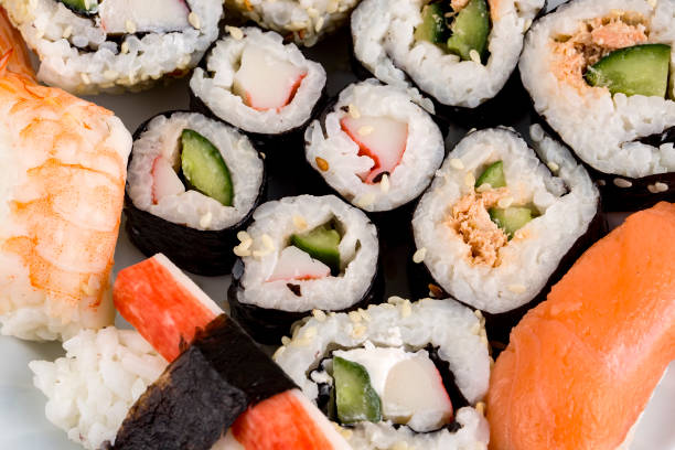 istock Sushi rolls japanese food isolated on white background. 1077146370