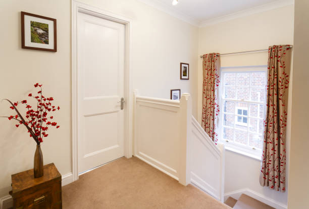Upstairs landing in a house Upstairs landing hallway in a contemporary style house in England landing home interior stock pictures, royalty-free photos & images