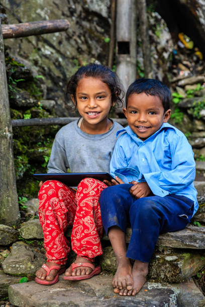 istock Nepali children using digital tablet near Annapurna Range 1077154164