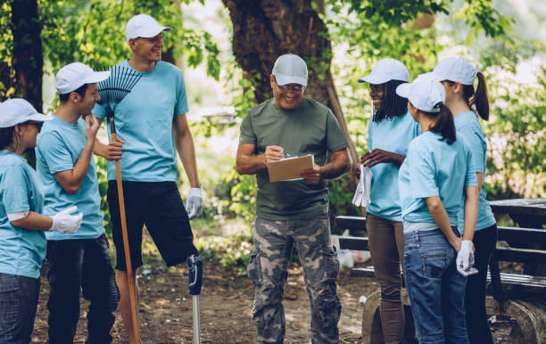 istock Volunteers organizing for cleaning 1077157640