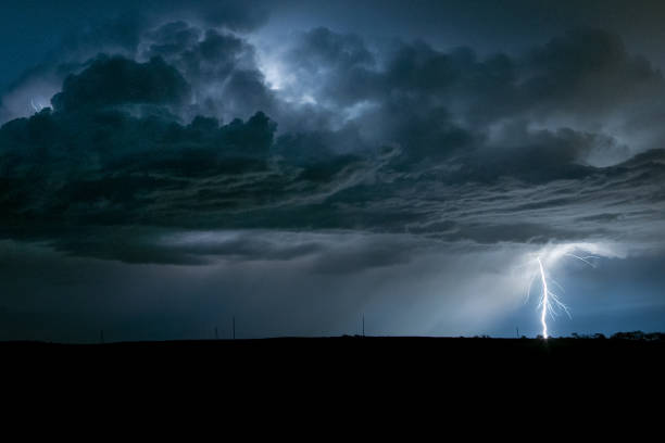 Lightning from a high based storm near Bismarck, North Dakota Lightning is a sudden electrostatic discharge that occurs typically during a thunderstorm. Here the discharge occurs between a cloud and the ground CG lightning. dramatic sky stock pictures, royalty-free photos & images