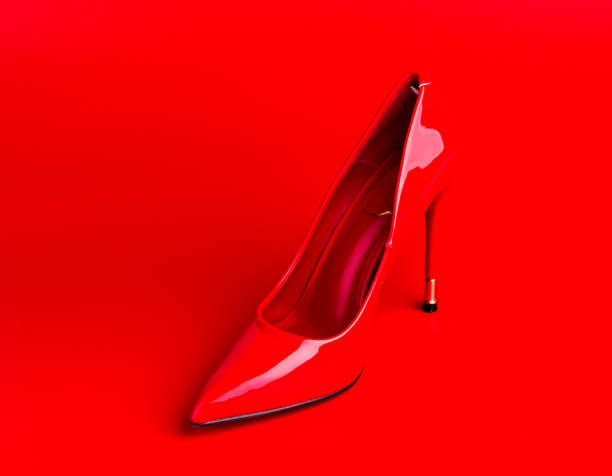 istock Red high heel shoe on red 1077163634
