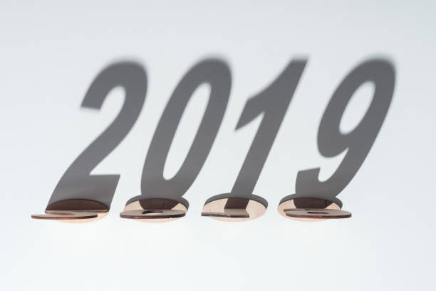 istock top view of wooden numbers with 2019 shadow on white background 1077163784