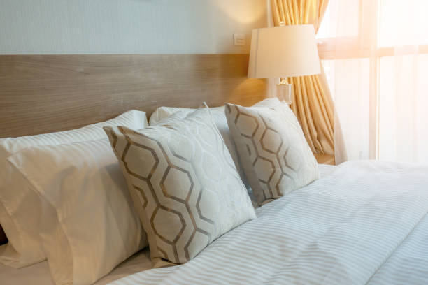 istock house beautiful design concept with soft cozy white pillow on bed in bedroom interior background 1077168812