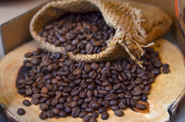 istock Roasted coffee beans on wooden 1077169042