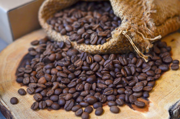 istock Roasted coffee beans on wooden 1077169044