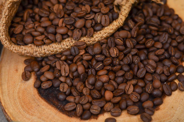istock Roasted coffee beans on wooden 1077170574