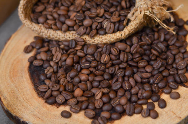 istock Roasted coffee beans on wooden 1077170586