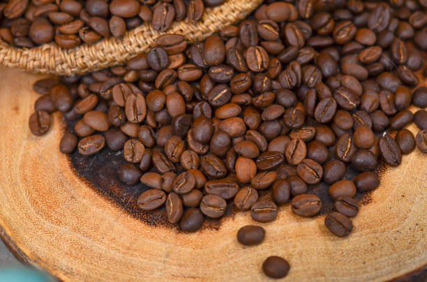 istock Roasted coffee beans on wooden 1077170648