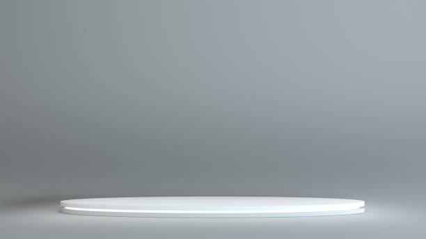 istock White round podium on a dark background 1077171410