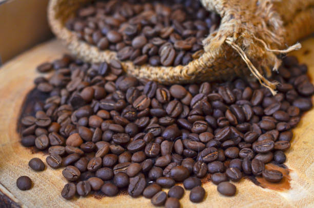 istock Roasted coffee beans on wooden 1077172194