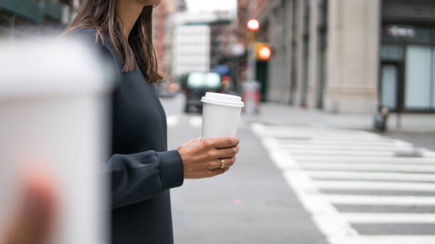 istock Young woman with coffee in New York 1077172516