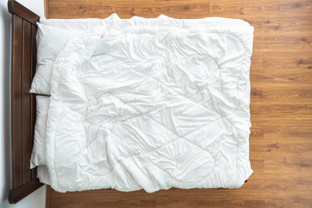 istock The bed with a white linens. view from above 1077172668