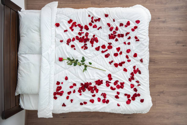 istock The bed with a rose petals. view from above 1077175274
