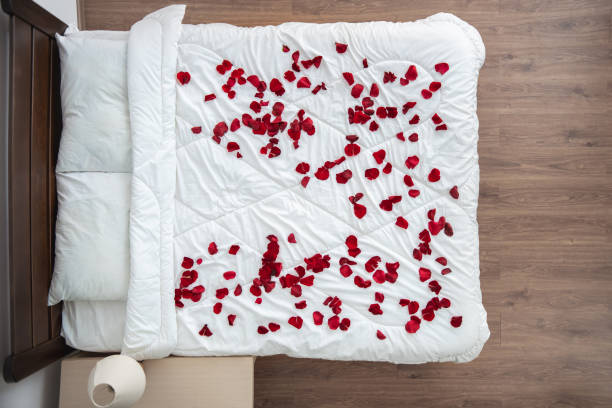 istock The bed with a rose petals. view from above 1077175304