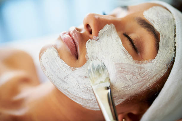 Even your skin deserves to detox Shot of an attractive young woman getting a facial at a beauty spa facial chemical peel stock pictures, royalty-free photos & images