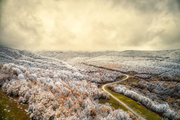 istock Two seasons - winter and autumn scene 1077190584