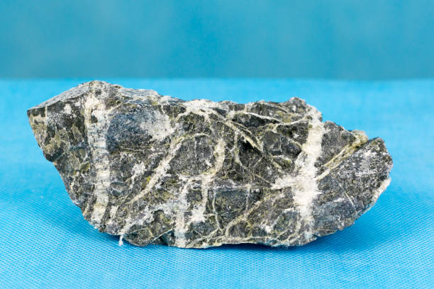 istock Dangerous mineral asbestos stone with fiber. 1077194572