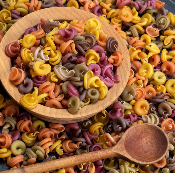 istock multicolored spiral raw pasta fusilli 1077195478