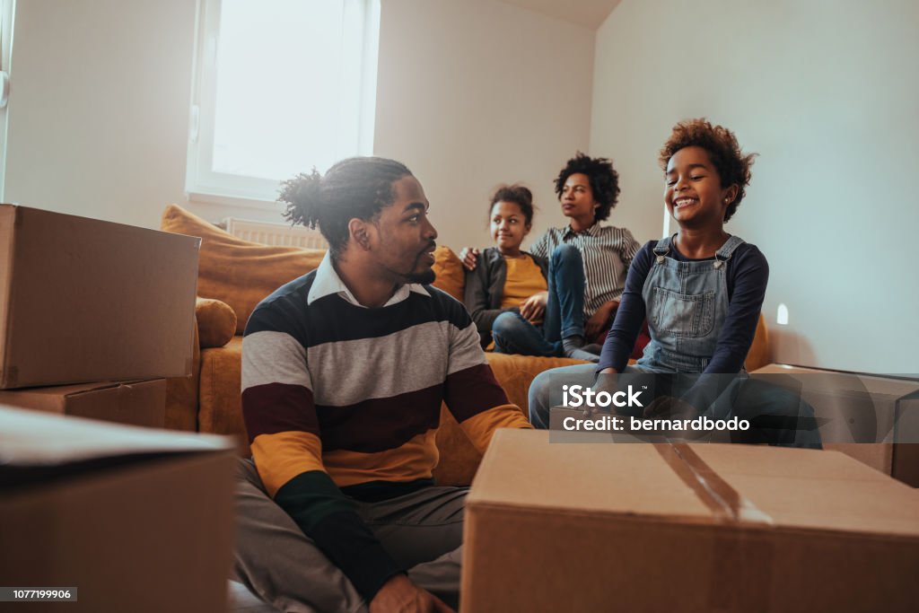 Moving can be fun after all Lovely family is moving in their new apartment 30-39 Years Stock Photo