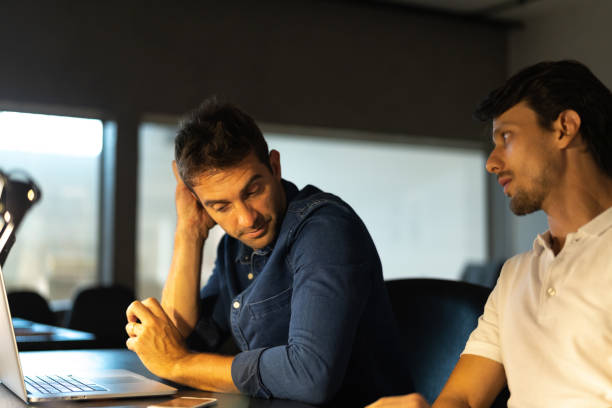 istock Worried businessman at meeting 1077202746