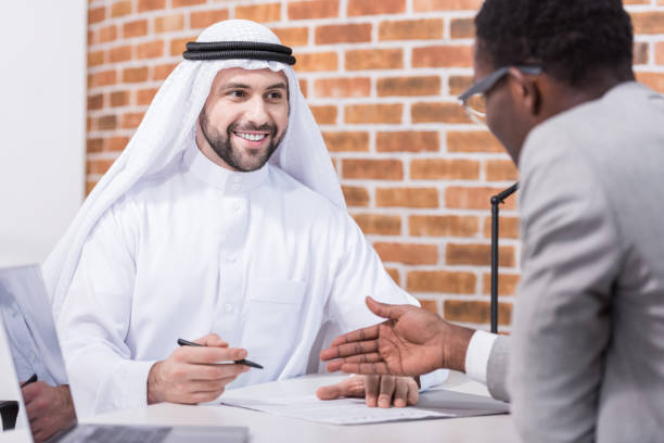 istock Arabian businessman signing contract at office desk 1077202820